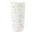 White tumbler with colorful speckles on a white background