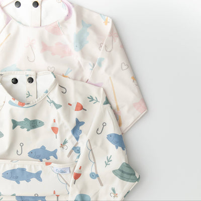 Baby bibs with shark and fish pattern on a white background