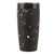 Black tumbler with speckled pattern on a white background