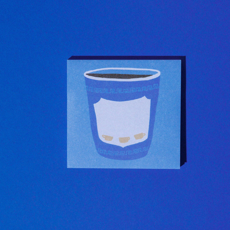 A square sticky note pad labeled 'To-Brew Lists' in white script, shown on a solid pink background. The pad features a blue coffee cup illustration 