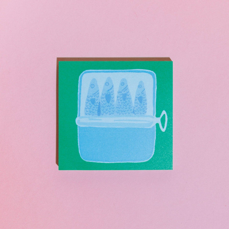 Sticky note pad with 'Tinned Fish Lists' on a pink background