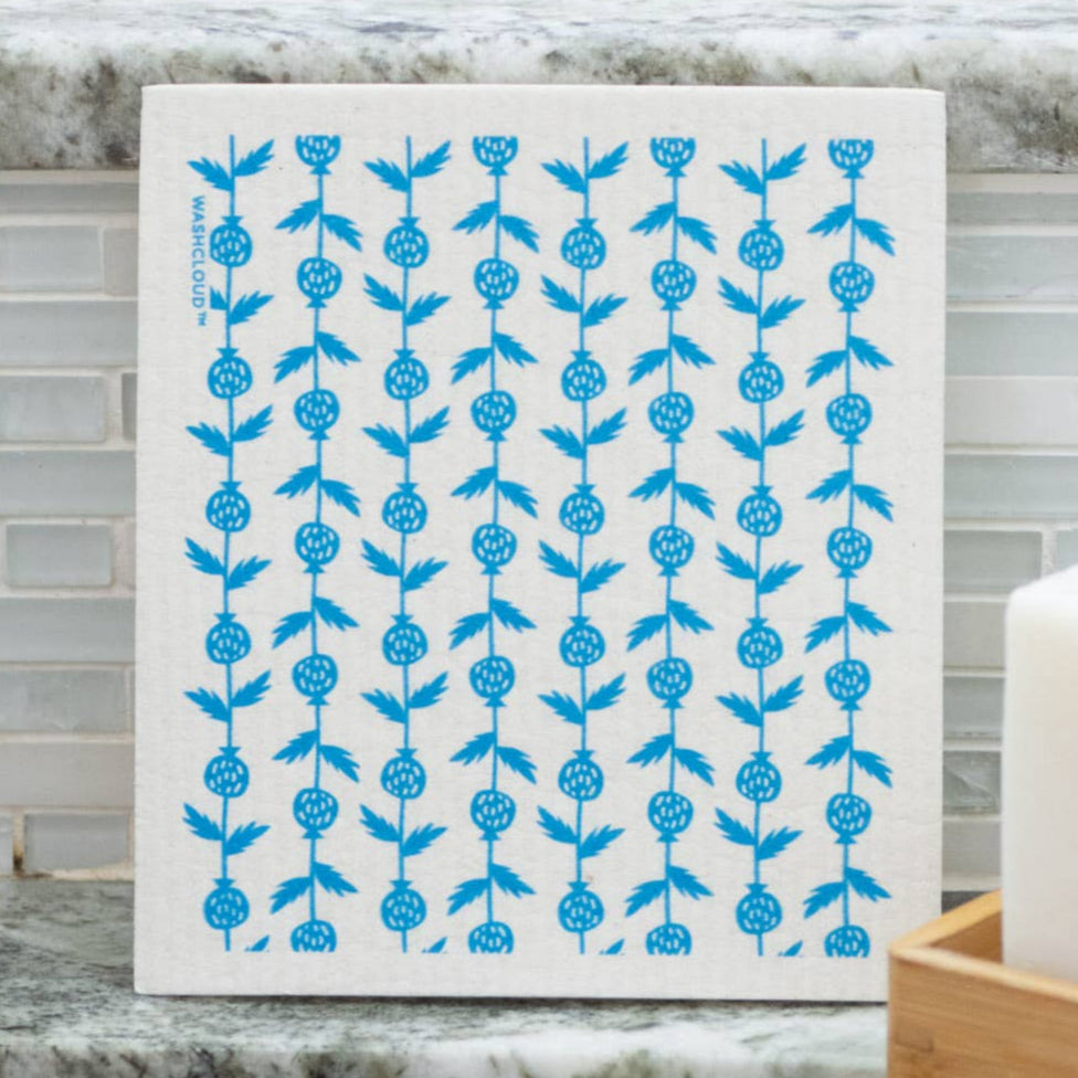 White dishcloth with blue floral pattern on a kitchen counter