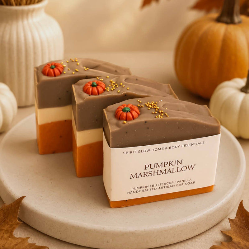 Pumpkin marshmallow soaps displayed artistically with pumpkins in the background. 