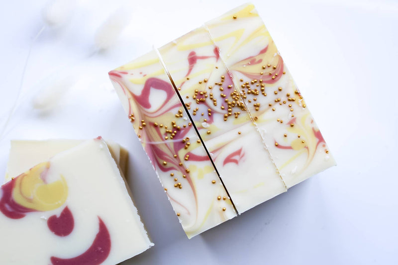 Decorative soap bars with colorful swirls on a white background