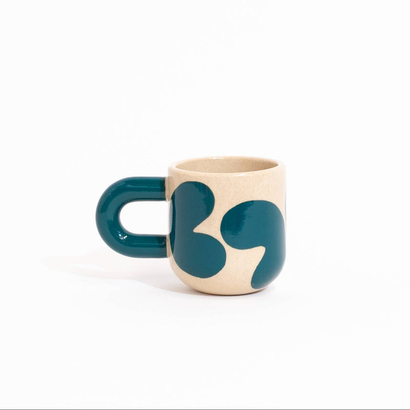 Four small ceramic mugs with abstract organic shapes in blue, green, and orange on a cream base, arranged together on a white background.