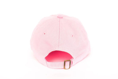 Pink baseball cap with a gold buckle on a white background