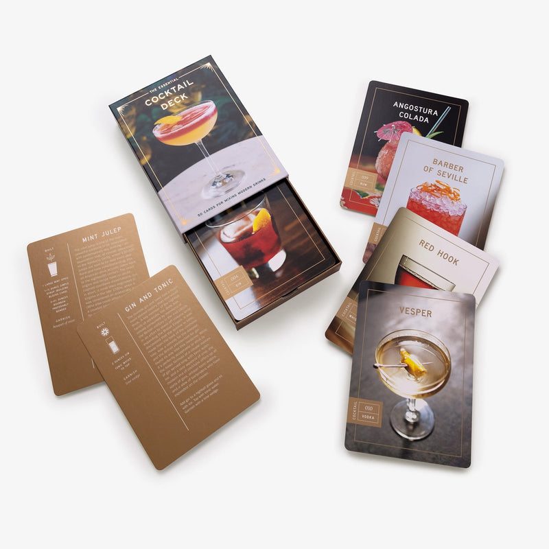 Box of a deck of cards with a cocktail on a white background
