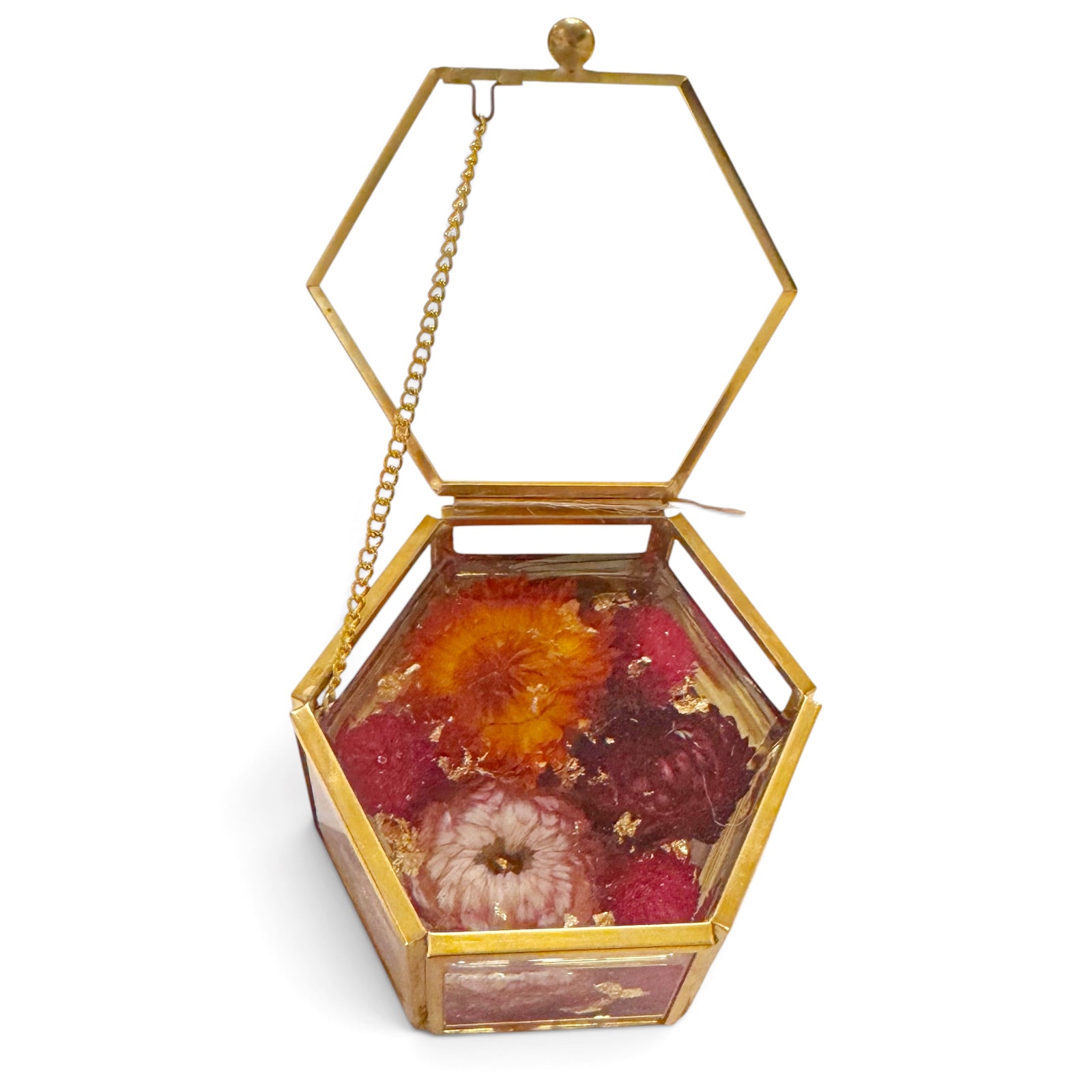 Vintage style jewelry box with a chain lid and flowers in resin set on a white background.