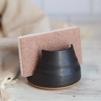 Black ceramic Sponge holder on a light surface