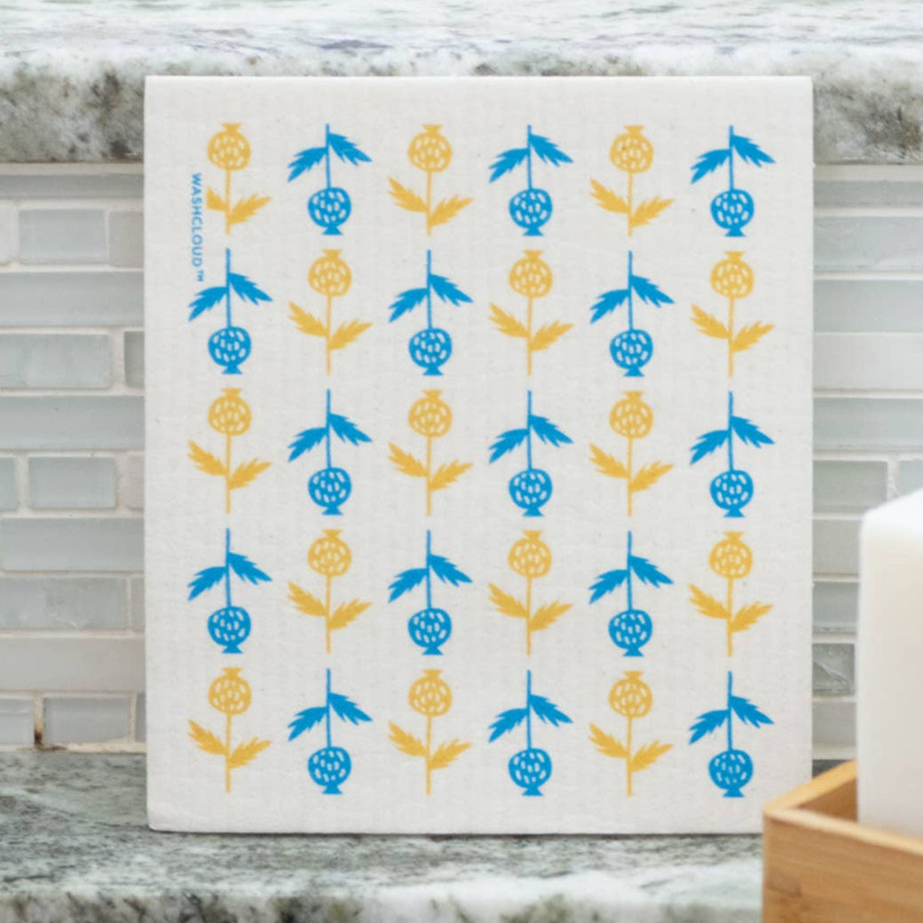 Dishcloth with blue and yellow pattern on a kitchen counter