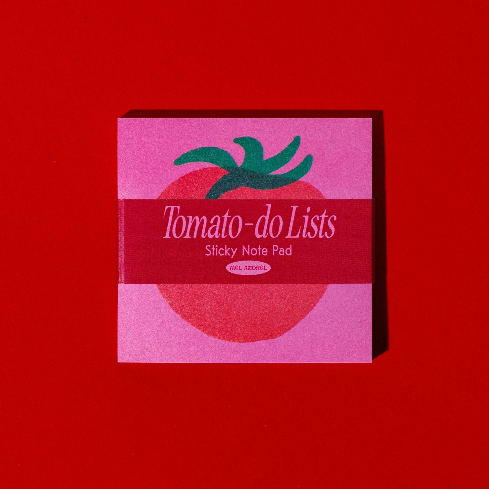 Pink sticky note pad with tomato design and 'Tomato-do Lists' text on a red background