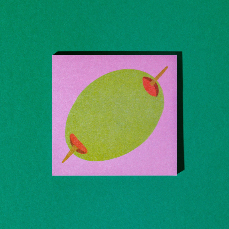 Olive Notes sticky note pad on a green background
