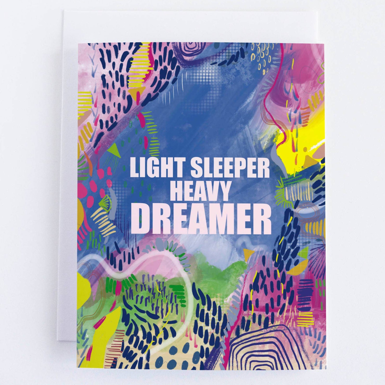 Colorful abstract design with text 'Light Sleeper Heavy Dreamer' on a white background
