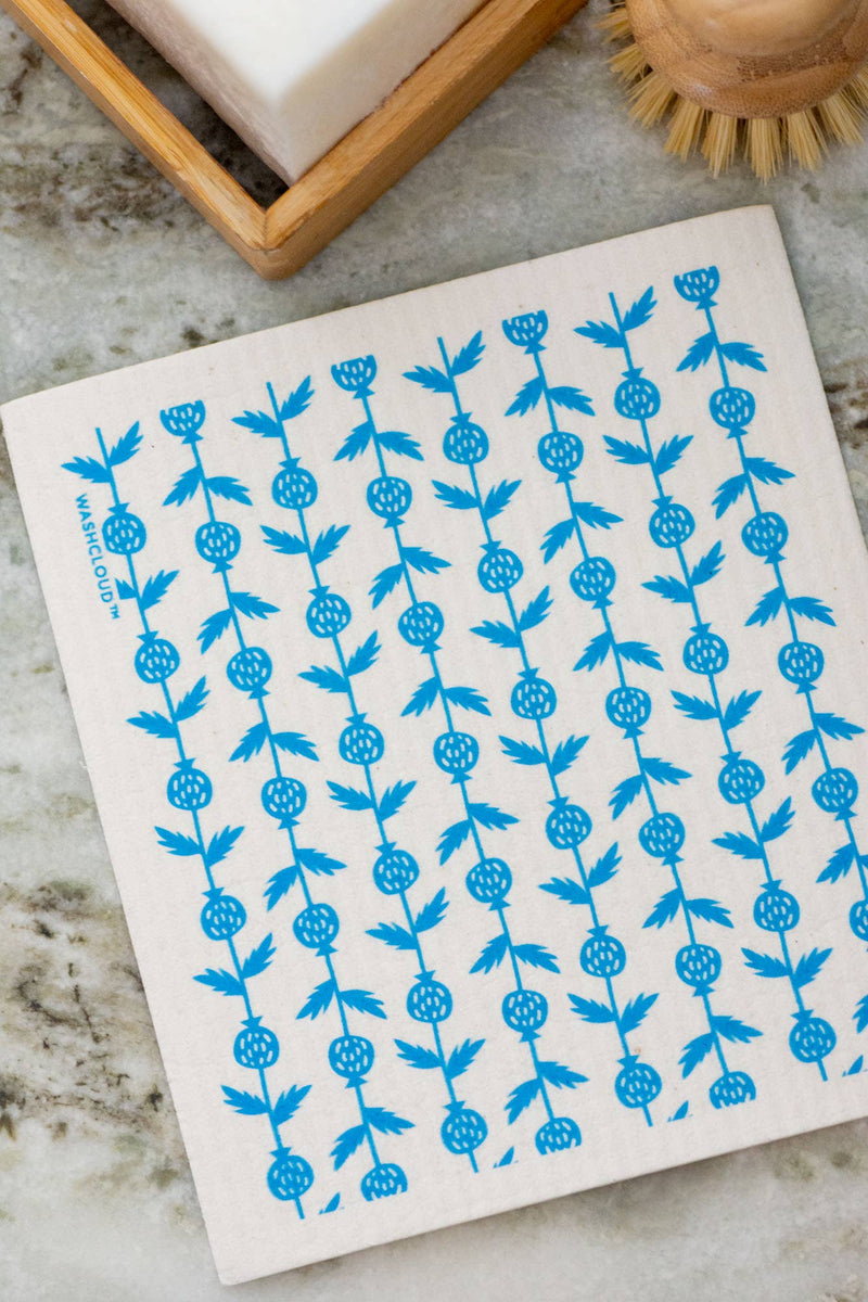 White dishcloth with blue floral pattern on a kitchen counter