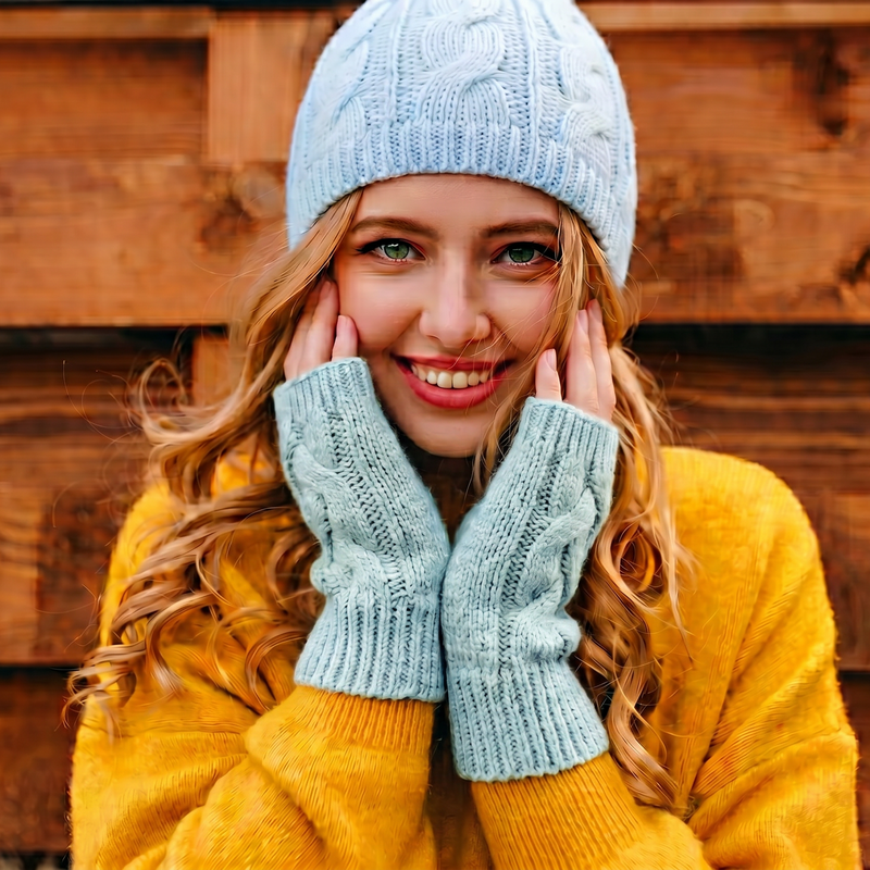 Light blue knitted beanie on a white background