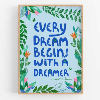 Card with motivational quote 'Every dream begins with a dreamer' surrounded by floral and leaf designs on a light blue background.