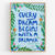 Card with motivational quote 'Every dream begins with a dreamer' surrounded by floral and leaf designs on a light blue background.