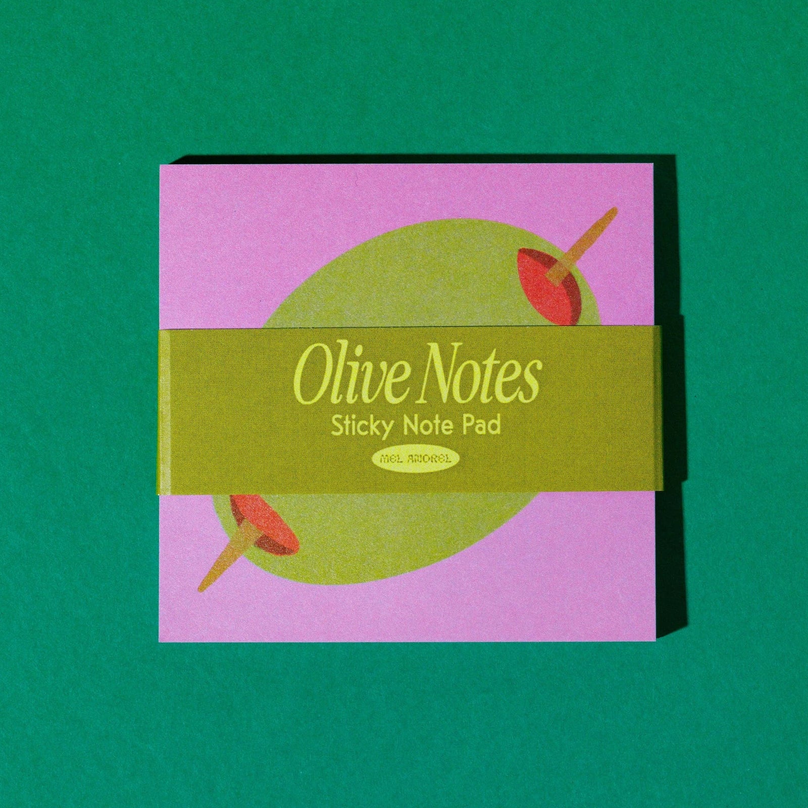 Olive Notes sticky note pad on a green background