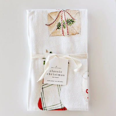 Packaged Christmas-themed kitchen towel with decorative design on a white background